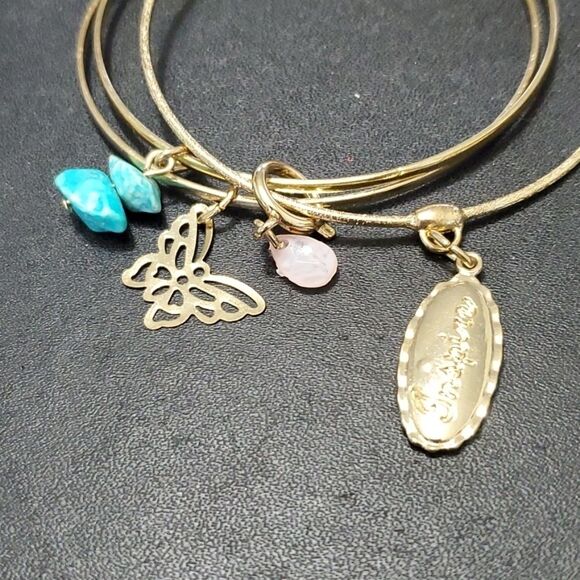 Gold tone layered bracelet with charms - Picture 1 of 9
